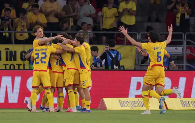 Romania celebrate going 2-1 up against Wales