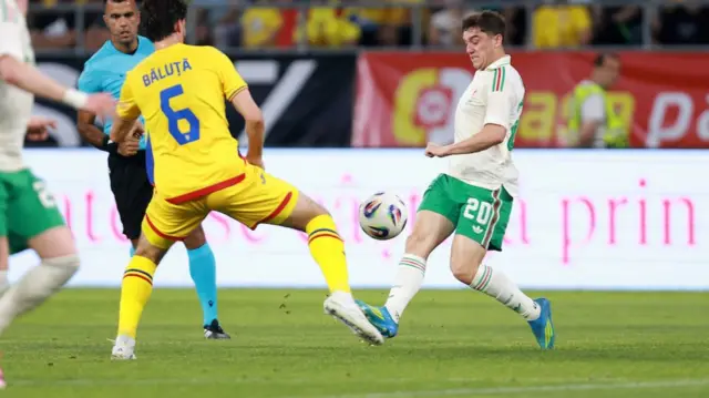 Dan James battles for the ball
