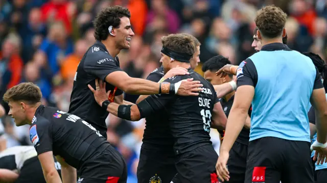 Exeter players celebrate try
