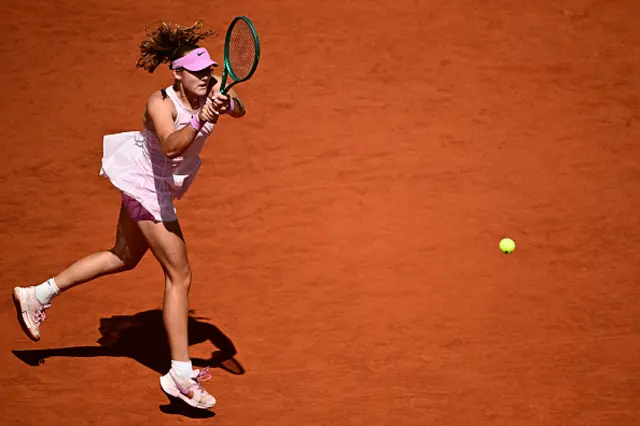Mirra Andreeva plays a backhand return