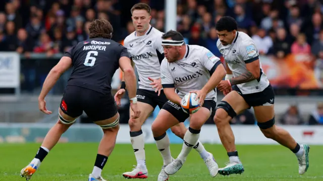 Jamie George goes to pass the ball