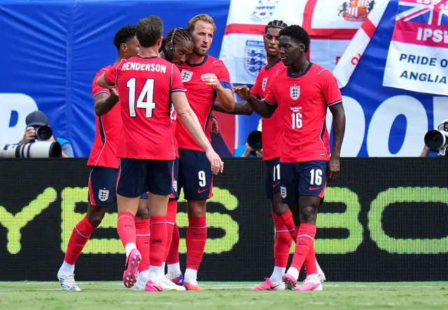 Harry Kane #9 of England celebrates scoring his team's first goal with teammates during the international friendly match between England and New Zealand