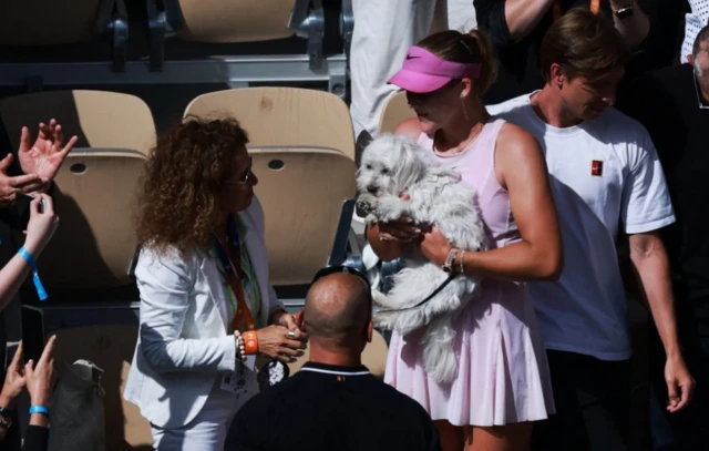 Russia's Mirra Andreeva celebrates with family