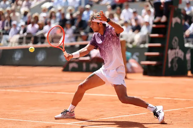 Flavio Cobolli of Italy plays a backhand
