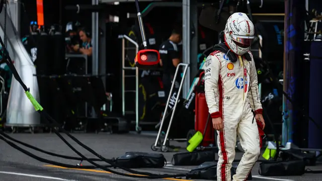 Charles Leclerc walking back to the Ferrari garage