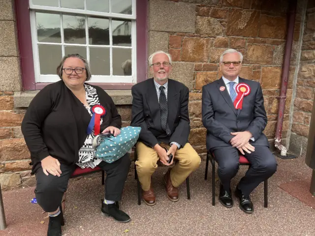 Candidates sitting outside a polling station