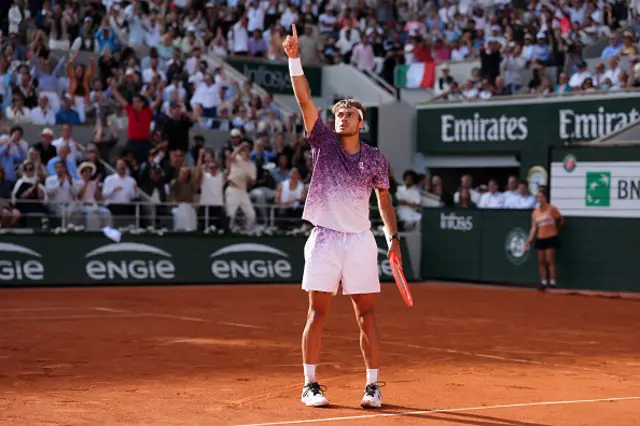 Italy's Flavio Cobolli reacts after a point during a tie break