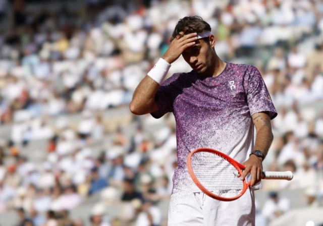 Flavio Cobolli of Italy looks on