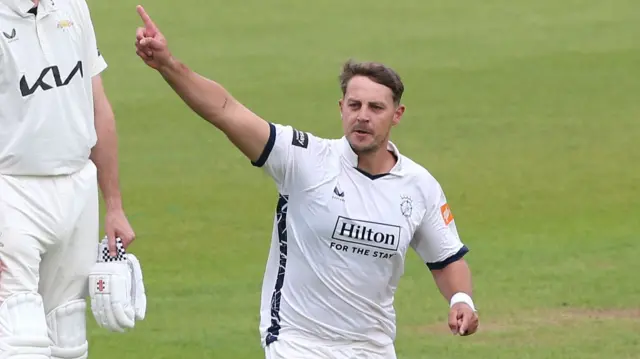 Delano Potgieter celebrates the wicket of Rory Burns