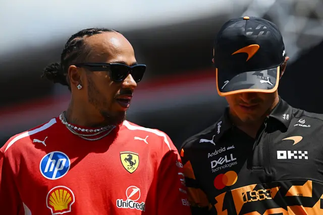 Lewis Hamilton chats to Lando Norris