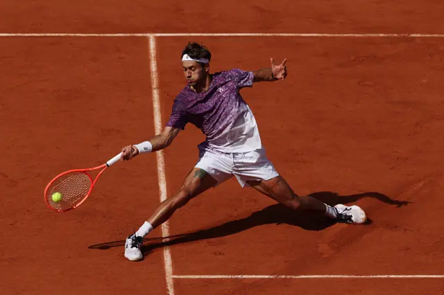 Flavio Cobolli of Italy plays a forehand