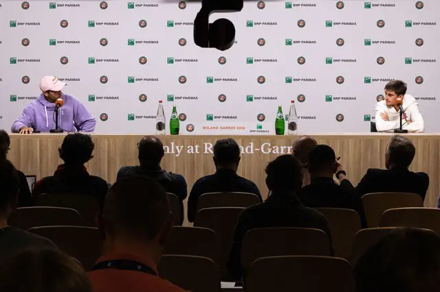 Matteo Arnaldi (right) and Flavio Cobolli (left) attend a press conference after Arnaldi's withdrawal from the men's singles semifinal match