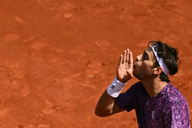 Italy's Flavio Cobolli reacts