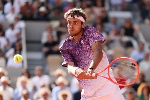 Flavio Cobolli of Italy plays a backhand