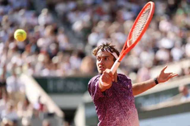 Flavio Cobolli of Italy plays a backhand
