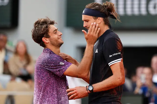 Winner Germany's Alexander Zverev cheers Italy's Flavio Cobolli at the end of their men's final singles match