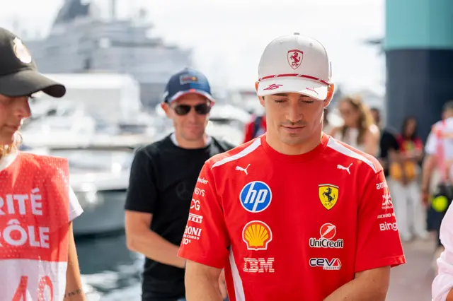 Charles Leclerc arrives in the paddock in Monaco