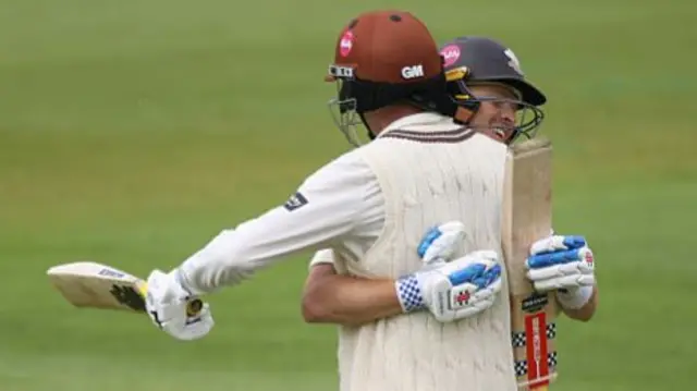 Ollie Pope and Dan Lawrence embrace