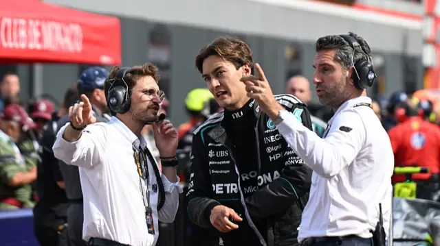 George Russell talking to FIA officials