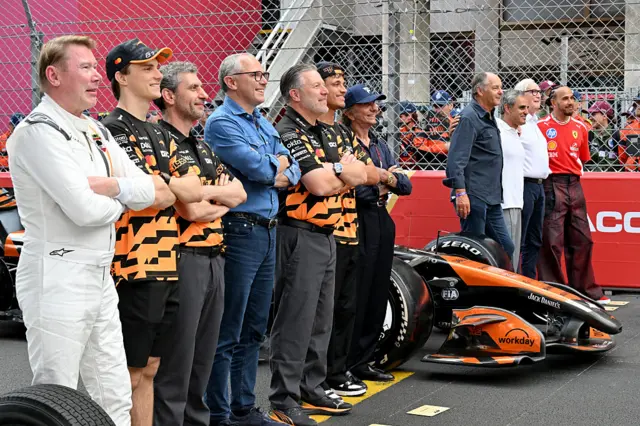 McLaren drivers past and present pose for photos to celebrate McLaren's 1,000th grand prix