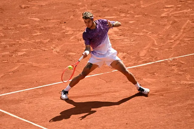 Alexander Zverev (not seen) and Italy's Flavio Cobolli compete
