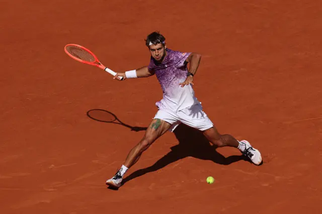 Flavio Cobolli of Italy plays a forehand