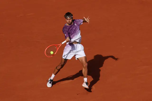 Flavio Cobolli of Italy plays a forehand