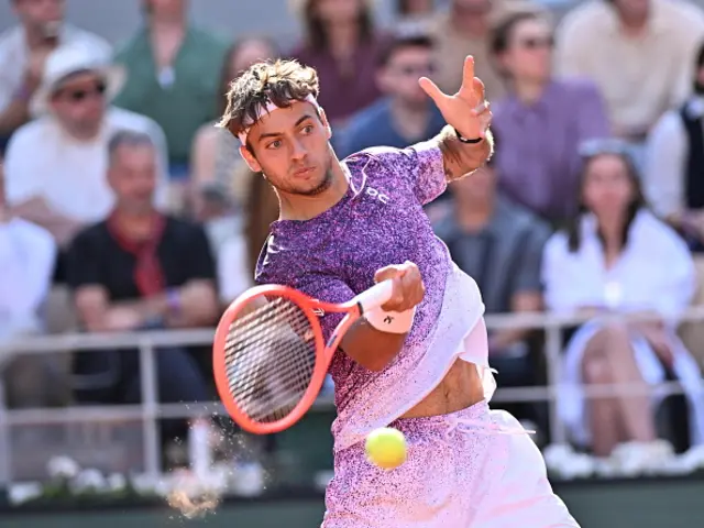 Germany's Alexander Zverev (not seen) and Italy's Flavio Cobolli compete
