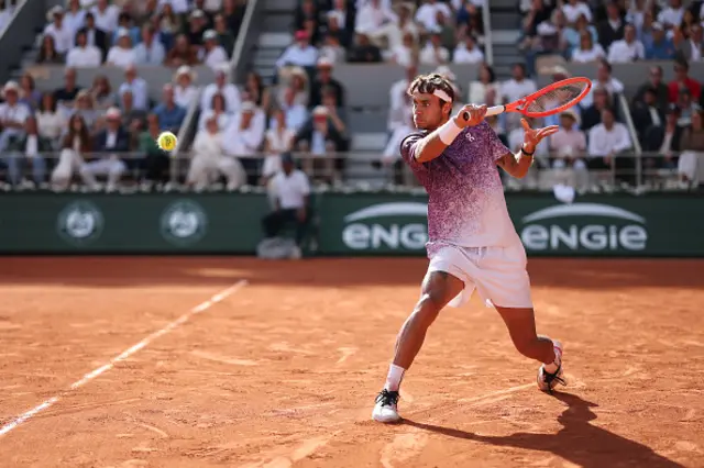 Flavio Cobolli of Italy plays a backhand