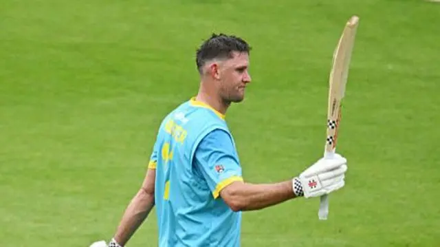 Beau Webster raises his bat after his 112 at Somerset