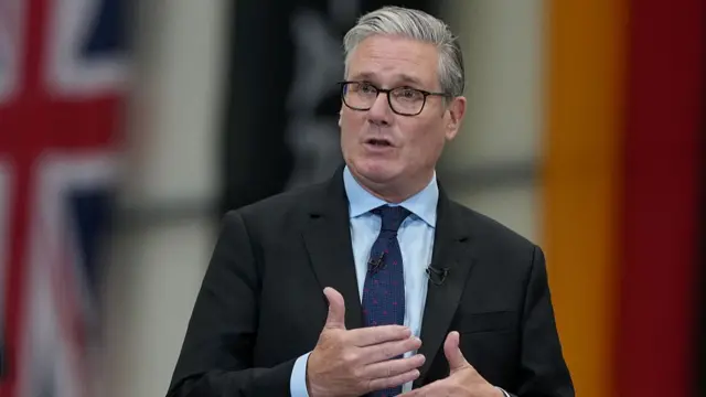 Prime Minister Keir Starmer gesturing while speaking.