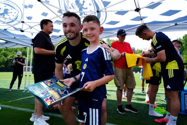 McGinn with fans after training