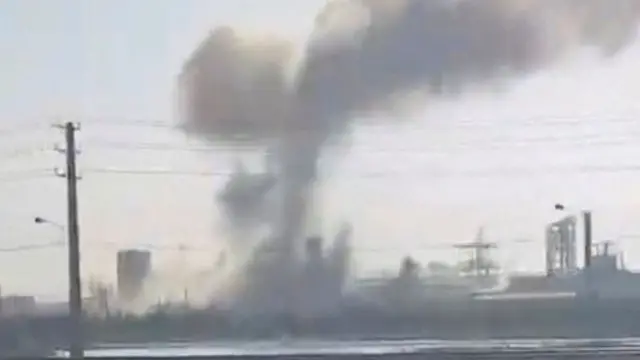 Smoke can be seen rising into the sky near Mahshahr petrochemical complex in a photo taken alongside a nearby road