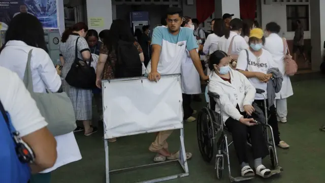 People waiting at a shelter