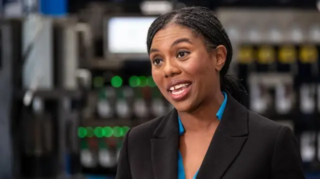 Conservative Party leader Kemi Badenoch pictured wearing a blue blouse and black blazer