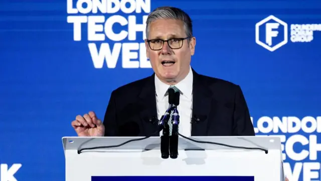Starmer pictured talking in front of a pedestal