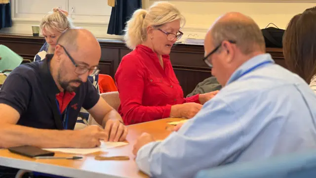 People counting votes in St Helier following Jersey's election in 2026