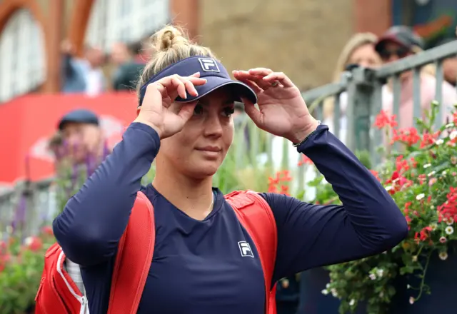 Romania's Jaqueline Cristian prepares for her game against Qinwen Zheng