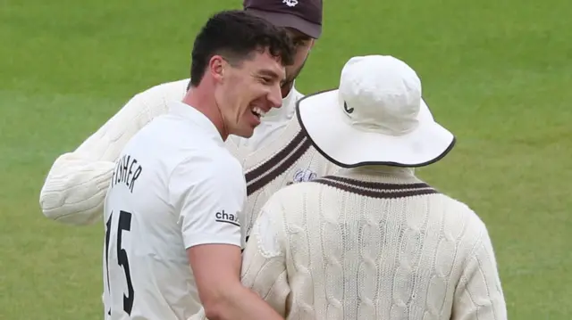 Matt Fisher is congratulated by skipper Rory Burns