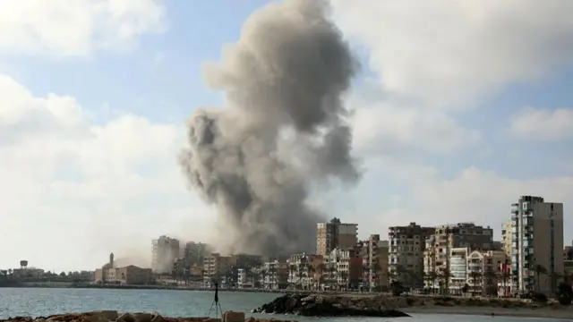 Smoke rises from the site of an Israeli air strike in the southern Lebanese coastal city of Tyre on Sunday