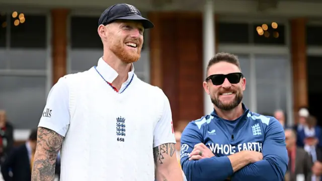 Ben Stokes smiling next to Brendon McCullum