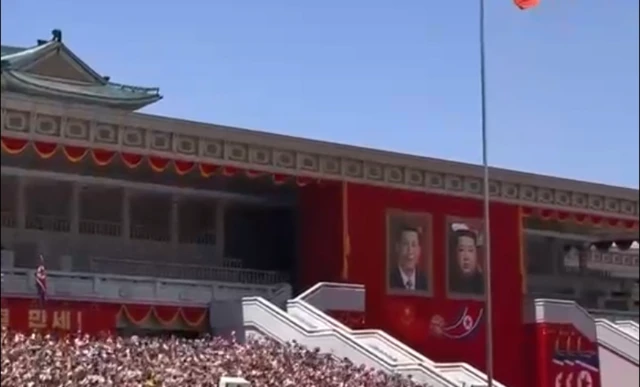 Portraits of Xi and Kim