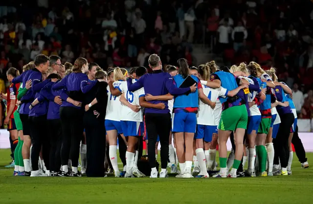 England women squad in a huddle