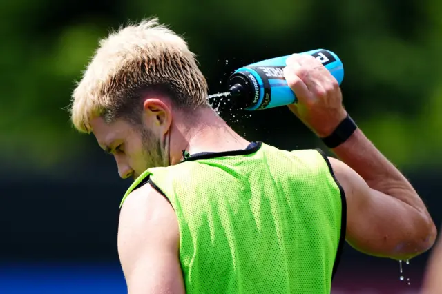 George Hirst cooling off in the heat yesterday