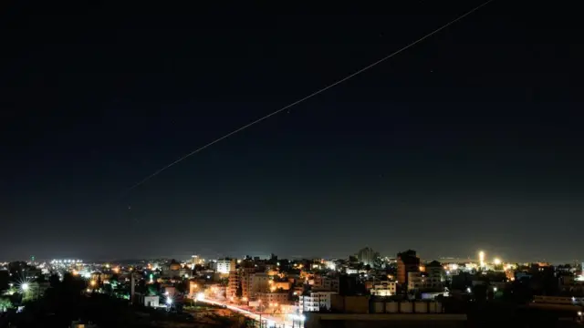 An Iranian missile flies in the sky over Israel, as seen from Hebron, in the Israeli-occupied West Bank, June 7, 2026.