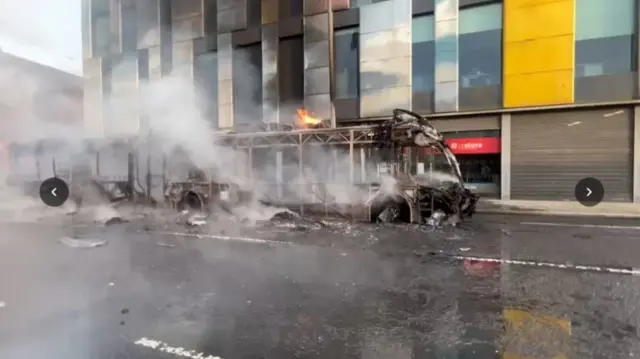 Shell of bus after fire