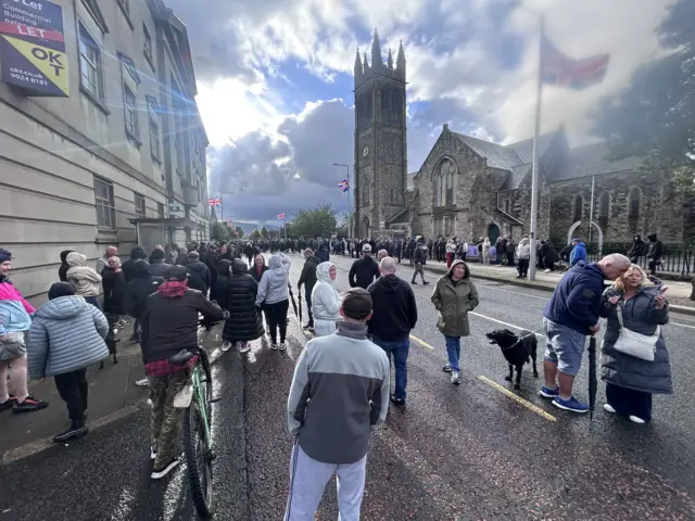 A crowd of people gathered at Freedom Corner on the Newtownards Road.