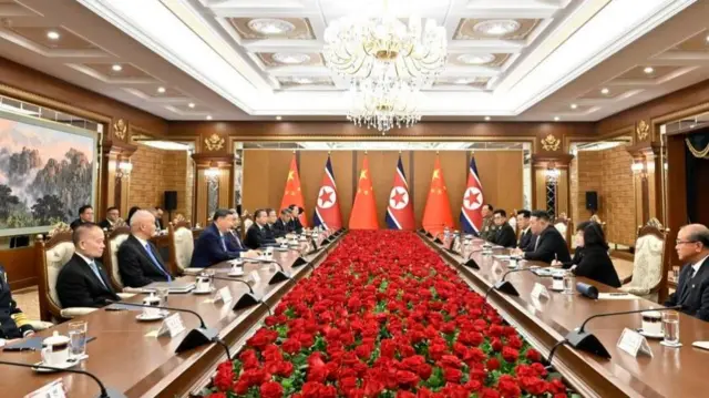 People seated at a long table
