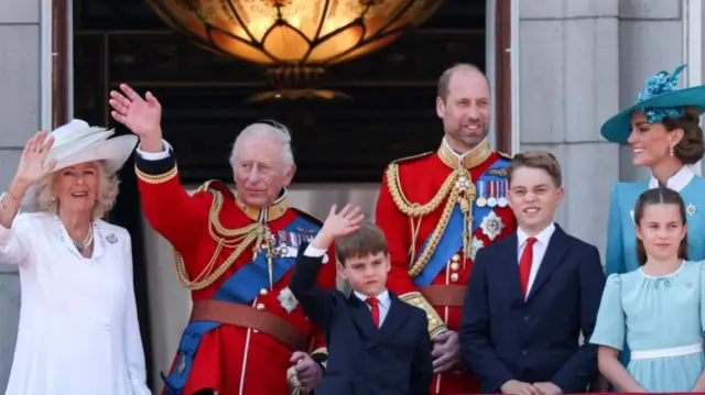 Members of the Royal Family wave to crowds from the balcony at Buckingham Palace.