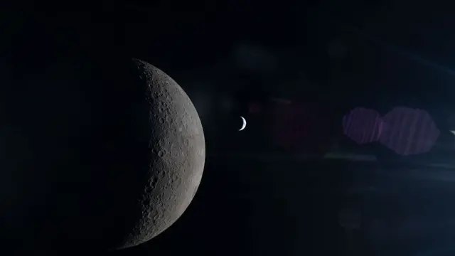 The half-illuminated Moon is seen from the Artemis II mission in the foreground, with the crescent Earth visible in the background